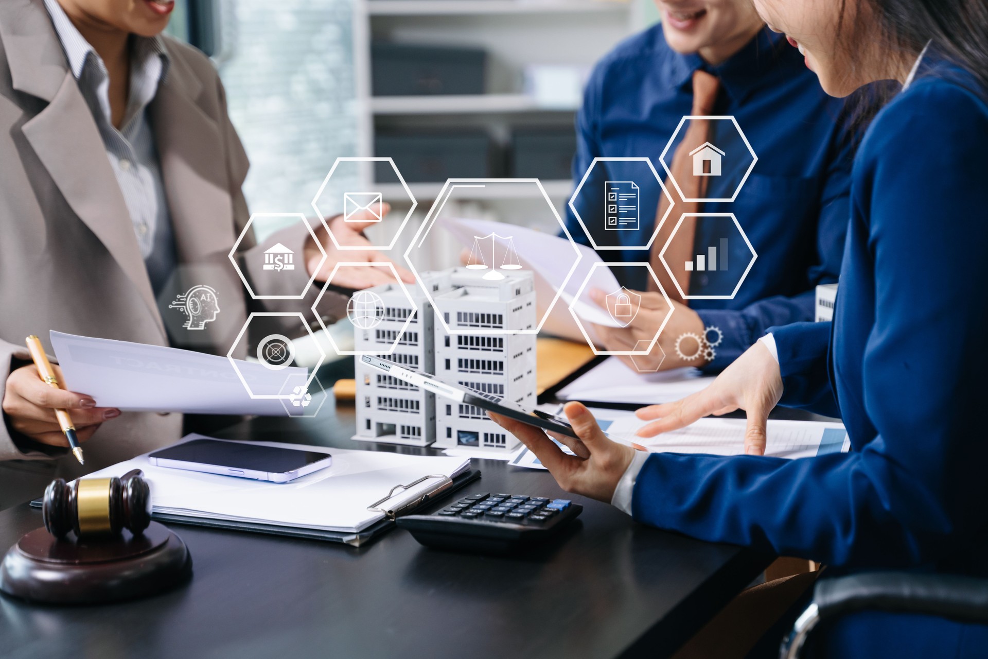 business meeting with legal and real estate advisors using AI technology, digital interfaces, and data-driven planning in a smart office